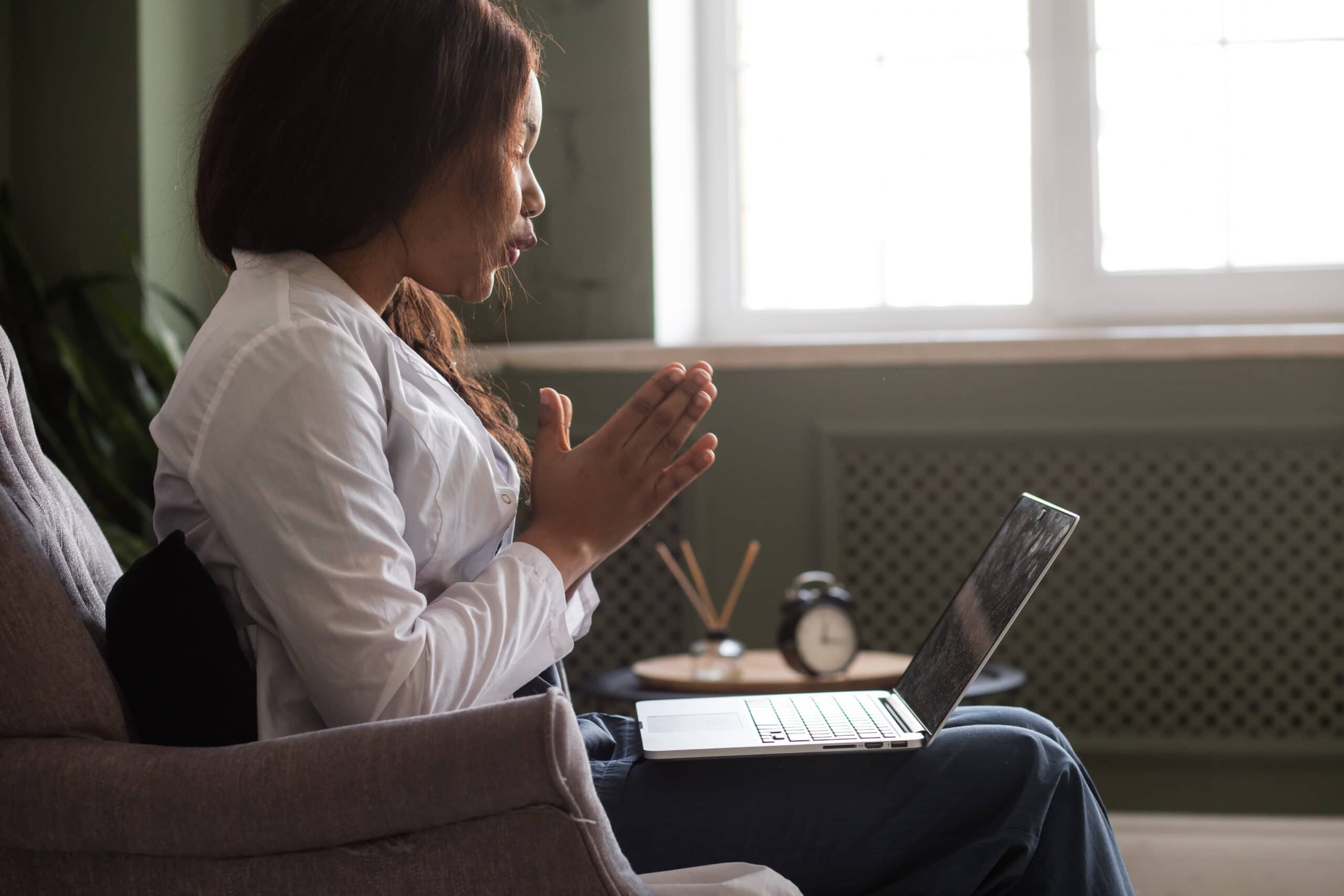 telehealth with virtual afro American doctor appointment and online therapy session. Black doctor online conference. High quality photo